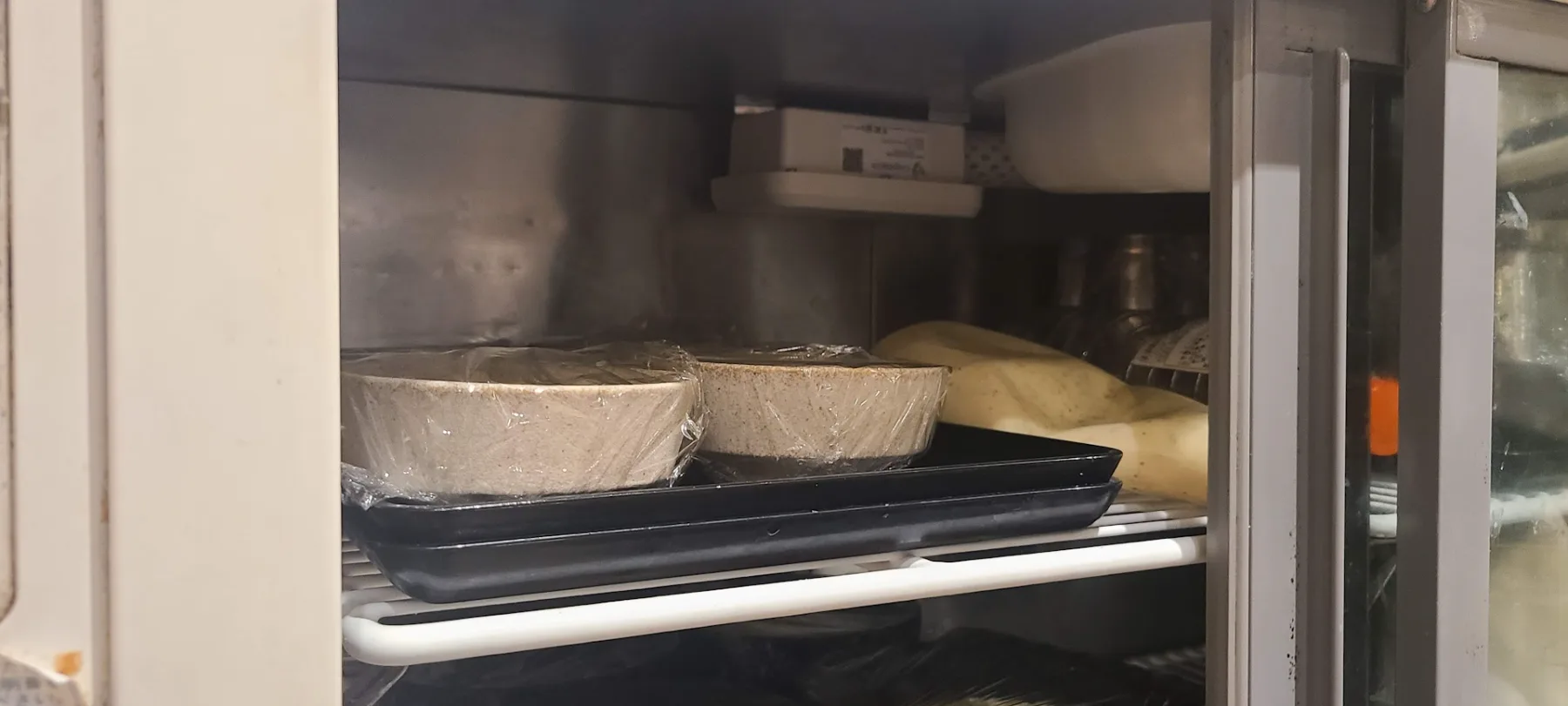 A CropWatch wireless sensor mounted inside a commercial restaurant refrigerator monitoring food storage temperature